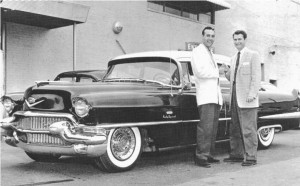 Carl Perkins and Sam Phillips with a 1956 Coupe De Ville at Southern Motors in Memphis - ca. 1956